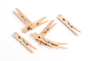 Wooden clothes pin isolated on white background. Top view, flat lay