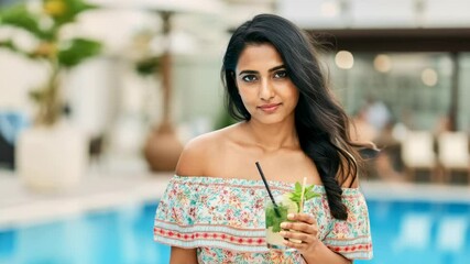 Joyful woman by the poolside with drink, transitioning from smile to serious - Powered by Adobe