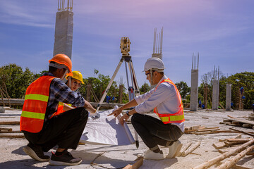 Structural engineer or architect and foreman worker with blueprints discuss, plan working for the outdoors building construction site. Construction collaboration concept