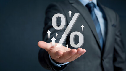 Businessman presents rising interest rates, illustrating financial growth and investment opportunities with a soaring percentage symbol and upward-pointing arrows, suggesting progress.
