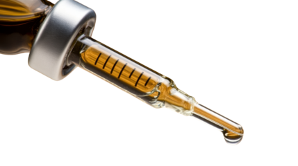 CBD Oil Dropper Close-Up: A close-up shot of a dropper filled with golden CBD oil, highlighting the clarity and purity of the extract, poised to deliver a single, potent drop.