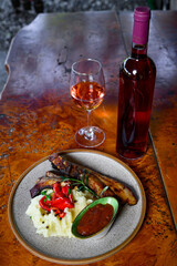 Pork ribs with mashed potatoes and sauce with wine