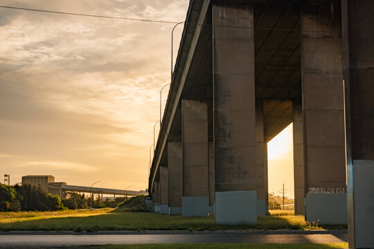 Concrete pylons under Stockton Bridge in Newcastle at sunset