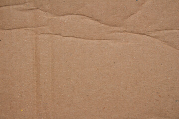 Abstract creased crumpled brown cardboard paper texture background design element