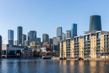 London, UK, 12 May 2025,  Canary Wharf A panoramic view of a modern cityscape with numerous tall...