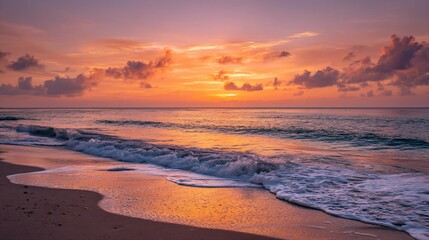 Obraz premium Caribbean sunset with orange and pink hues, calm waves, and a clean horizon, evoking serenity and natural beauty.