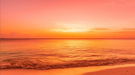 Obraz premium Caribbean sunset with orange and pink hues, calm waves, and a clean horizon, evoking serenity and natural beauty.