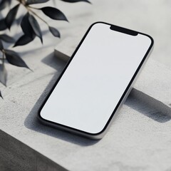 Minimalist smartphone on textured surface with leaves and shadows