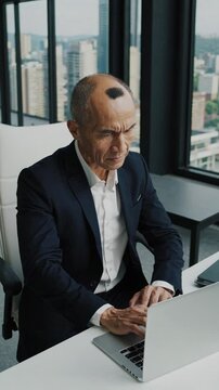 Bald in the middle head and begin no loss hair glabrous of mature Asian business smart active office man.