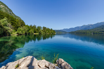 Summer at Lake Bohinj in the Julian Alps - a lake surrounded by mountains