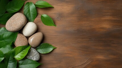 A collection of smooth stones surrounded by fresh green leaves creates a calming and peaceful natural arrangement perfect for promoting tranquility and balance.