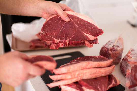 sorting a bulk meat purchase into meal sized portions