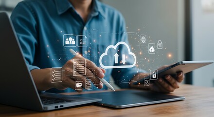 Man working with cloud computing data transfer and digital file management on various devices