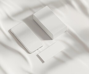 Minimalistic white smartphone with box and card on elegant fabric surface