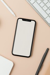 Modern smartphone on desk with keyboard, pens, and notebook