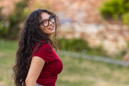 upper body shot of teen girl with long black hair cascading down her back