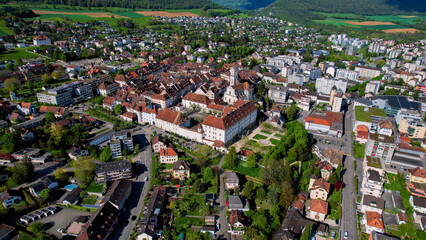 A panoramic aerial view around the old town of the city Delémont in Switzerland on a sunny spring...