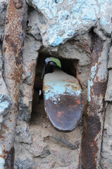 Old rusty padlock on the door of an abandoned house, close-up