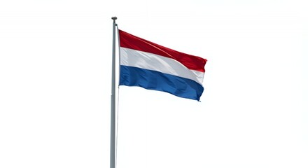 The Dutch flag billows proudly against a bright white sky.