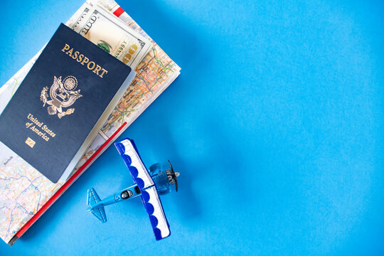 Vacation Preparation Concept
Passport, dollar bills, and maps suggest travel excitement. Adventure awaits. - Powered by Adobe