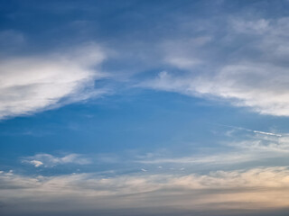Fantastic soft white clouds against blue sky. White fluffy clouds in the blue sky. Blue cloudy sky,...