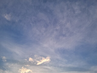 Fantastic soft white clouds against blue sky. White fluffy clouds in the blue sky. Blue cloudy sky,...