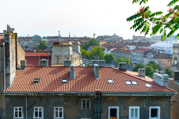 Terracotta rooftops and detailed facades of Rijeka’s old town create a classic European scene,...