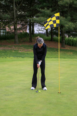 Golfer Preparing to Make a Putt