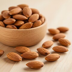 Healthy almonds piled in a wooden bowl and scattered on a light wooden surface
