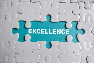 Fototapeta premium Piece of jigsaw puzzle and word Excellence.