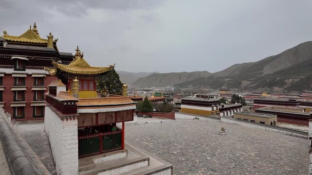 Xiahe, China: Panoramic footage of the Tibetan Buddhist Labrang Monastery in the Xiahe town in the Amdo region of Gansu province in China on a cloudy spring day. 
