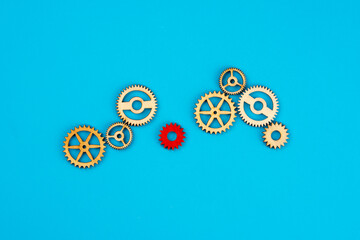 Wooden cogwheels on blue background