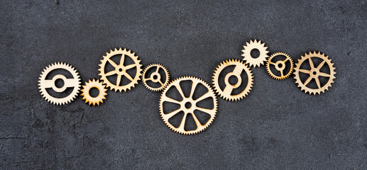  Wooden cogwheels on black background