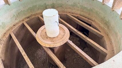 Aged water well with sun-kissed patina, echoing forgotten whispers, perfect for Earth Day...