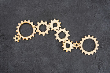  Wooden cogwheels on black background