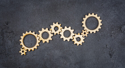  Wooden cogwheels on black background