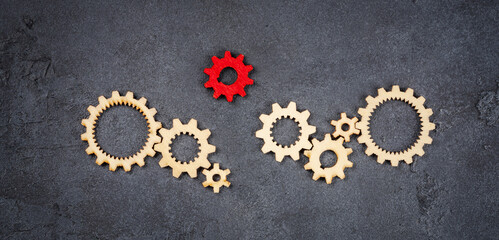 Wooden cogwheels on black background
