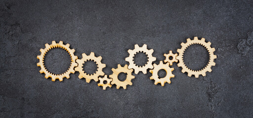  Wooden cogwheels on black background