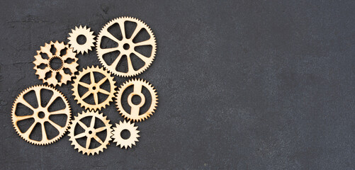  Wooden cogwheels on black background