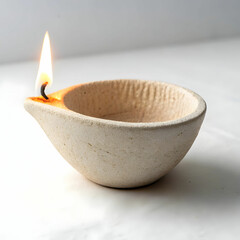 A traditional handcrafted clay oil lamp (diya) used for lighting during festivals