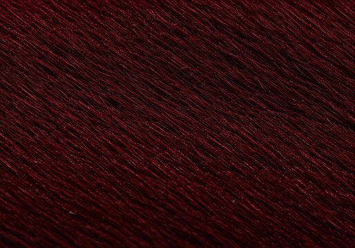A macro close-up of a luxurious, soft red fabric. A cozy and warm plush textile with a velvety texture, perfect as a rich, abstract background. - Powered by Adobe