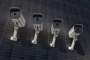 Four security cameras are mounted on a wall