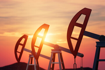Three oil wells with red caps and white bases