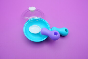 Toy Frying Pan and Spoon on Purple Background
