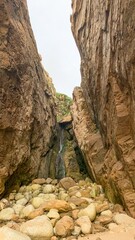 Majestic rocky gorge whispers ancient secrets and echoes folklore, perfect for Earth Day musings or serene geotourism contemplations