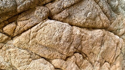 Craggy ancient stone texture resembling nature's patchwork quilt, embodying Earth's timeless geologic dance on Geologists Day