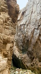 Ancient rocky chasm cradles whispers of nature's sculpting hand, evoking Earth Day musings and the poetry of Solstice solitude