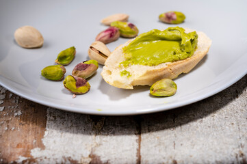 Pistachio cream on baguette, close up shot