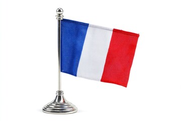The image shows a small tablesized French flag with a silver stand The flag is waving slightly