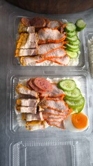 Boxed rice with red pork and crispy pork for delivery